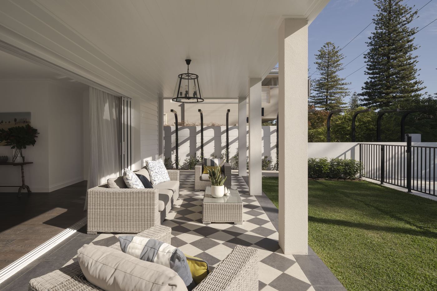 Covered outdoor living with chequerboard tile floor